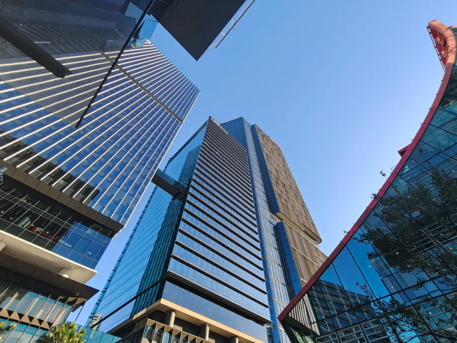 Modern towers rising over the Parramatta city centre against a clear blue sky
